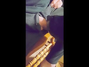Dog chewing and biting his cock